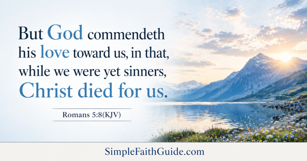 Romans 5:8 KJV Bible verse about God’s love displayed over a peaceful mountain lake at sunrise with a clean blue design